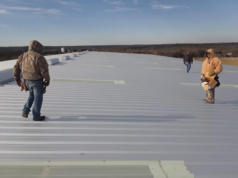 tpo roofing material installation by roofing contractor for commercial buildings